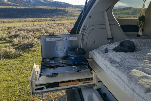 Compact and efficient burner in the Roadloft camper setup, perfect for cozy vanlife cooking.